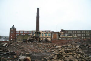 The demolition of Vine Mills, Oswaldtwistle. Copyright Chris Allen. Licensing information at https://www.geograph.org.uk/photo/2843855